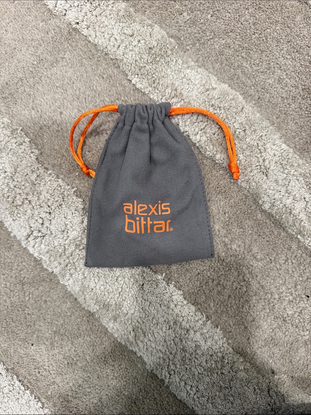 Alexis Bittar Gray Pouch with Orange Logo and Drawstrings